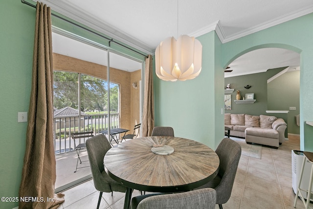 10075 Gate Pkwy N Unit 913, Jacksonville, FL 32246 - dining space featuring ornamental molding, arched walkways, and light tile patterned flooring