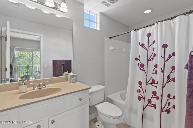 10075 Gate Pkwy N Unit 913, Jacksonville, FL 32246 - full bathroom with vanity, plenty of natural light, shower / bathtub combination with curtain, and a textured wall