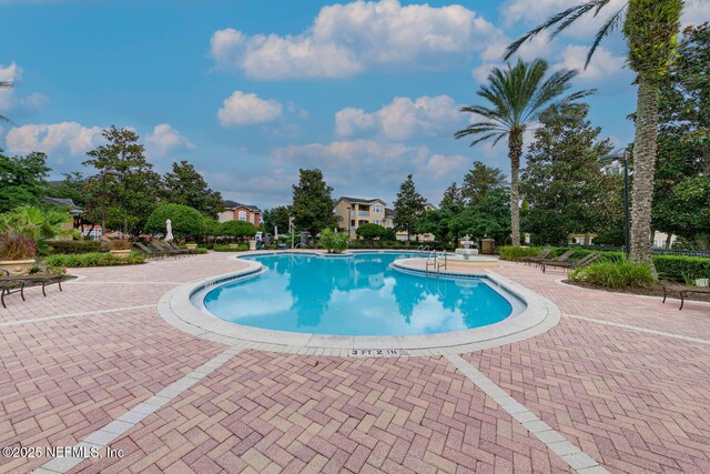 10075 Gate Pkwy N Unit 913, Jacksonville, FL 32246 - community pool featuring a patio