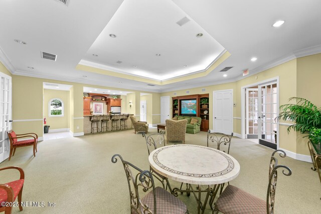 10075 Gate Pkwy N Unit 913, Jacksonville, FL 32246 - dining space featuring french doors, light carpet, a raised ceiling, crown molding, and recessed lighting