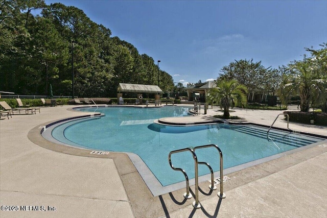 4705 Sawbuck St, Saint Augustine, FL 32092 - community pool featuring a patio area
