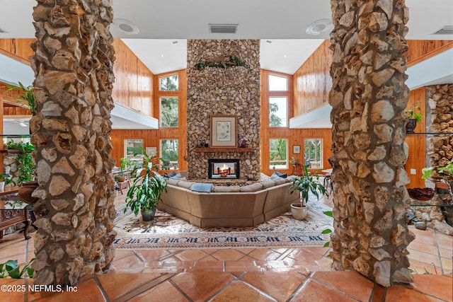 970 Fruit Cove Rd, Saint Johns, FL 32259 - living area with high vaulted ceiling, ornate columns, plenty of natural light, a fireplace, and wood walls