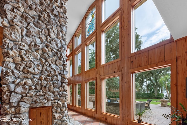 970 Fruit Cove Rd, Saint Johns, FL 32259 - doorway featuring plenty of natural light, wooden walls, light tile patterned floors, and a towering ceiling