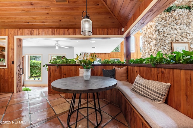 970 Fruit Cove Rd, Saint Johns, FL 32259 - tiled dining room with breakfast area, wood walls, and a ceiling fan