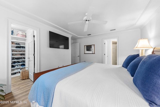 970 Fruit Cove Rd, Saint Johns, FL 32259 - bedroom featuring ornamental molding, wood finished floors, a spacious closet, and ceiling fan
