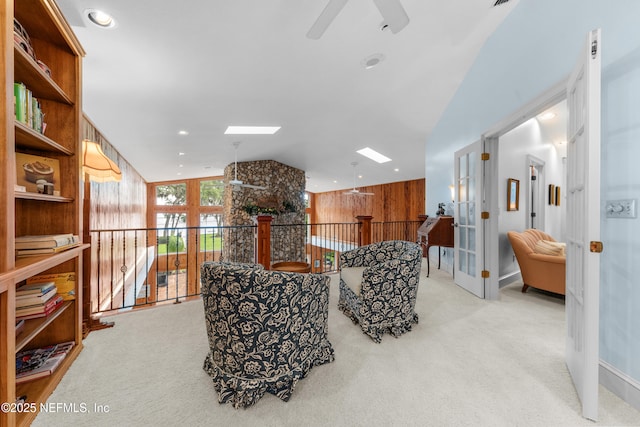 970 Fruit Cove Rd, Saint Johns, FL 32259 - sitting room with vaulted ceiling, carpet flooring, a ceiling fan, a skylight, and french doors