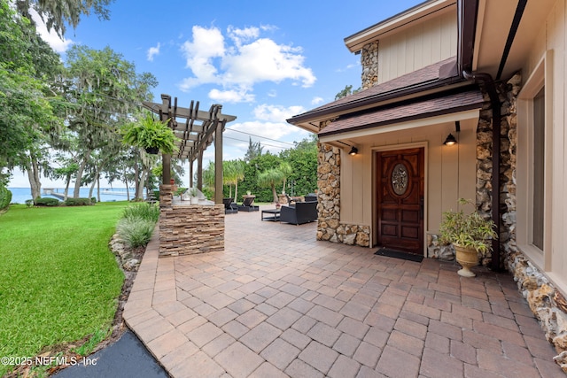 970 Fruit Cove Rd, Saint Johns, FL 32259 - property entrance with stone siding, a patio area, a lawn, and outdoor lounge area