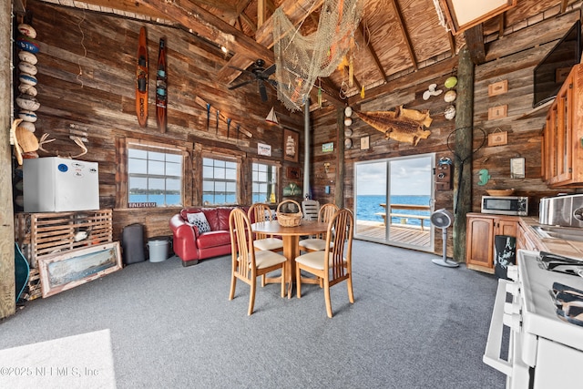 970 Fruit Cove Rd, Saint Johns, FL 32259 - dining space with wooden walls, high vaulted ceiling, carpet floors, and beam ceiling