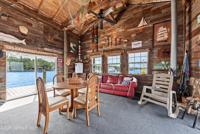 970 Fruit Cove Rd, Saint Johns, FL 32259 - dining area with wooden walls, carpet floors, high vaulted ceiling, plenty of natural light, and ceiling fan