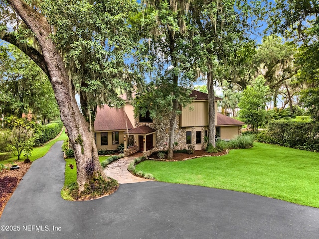 970 Fruit Cove Rd, Saint Johns, FL 32259 - view of front facade featuring stone siding and a front lawn
