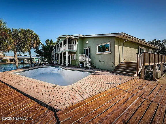 5903 Bimini Way N, Saint Petersburg, FL 33706 - view of swimming pool featuring stairs, an empty pool, and a patio