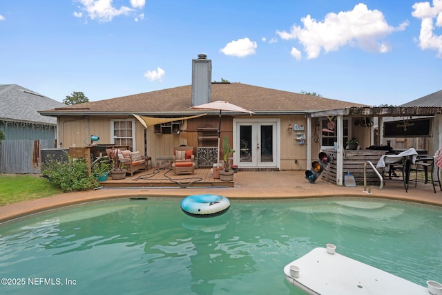 1942 Calusa Trl, Middleburg, FL 32068 - swimming pool with french doors and a patio