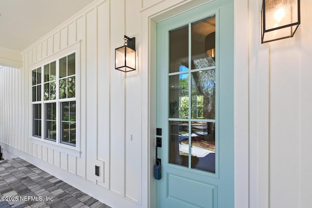 1501 Emma Ln, Neptune Beach, FL 32266 - entrance to property with a porch and board and batten siding