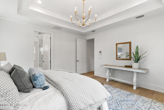 1501 Emma Ln, Neptune Beach, FL 32266 - bedroom with crown molding, a raised ceiling, a chandelier, wood finished floors, and recessed lighting