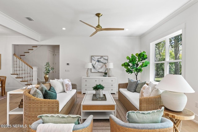 1501 Emma Ln, Neptune Beach, FL 32266 - living area featuring crown molding, wood finished floors, stairs, a ceiling fan, and recessed lighting