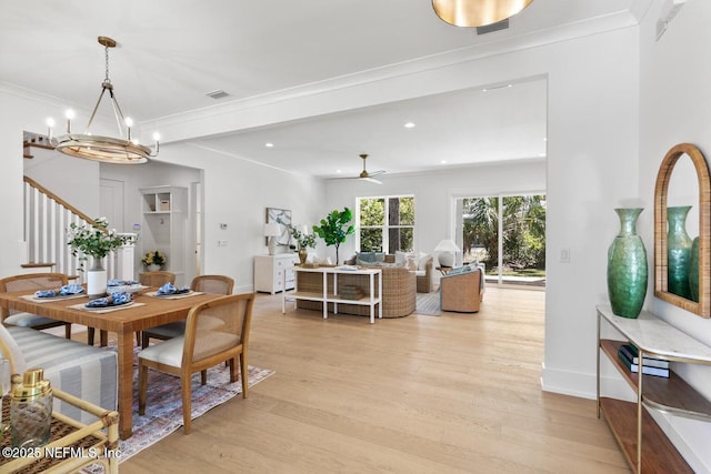 1501 Emma Ln, Neptune Beach, FL 32266 - dining space with light wood-style floors, a chandelier, stairway, a ceiling fan, and recessed lighting