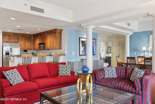 1478 Riverplace Blvd Unit 1605, Jacksonville, FL 32207 - living area featuring decorative columns, ornamental molding, and recessed lighting
