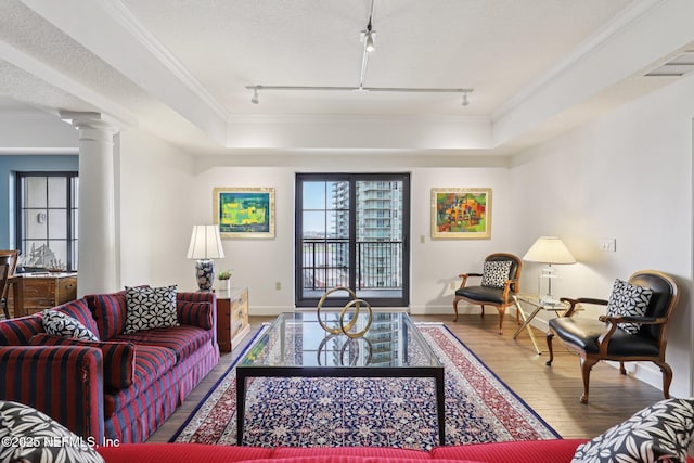 1478 Riverplace Blvd Unit 1605, Jacksonville, FL 32207 - living area featuring track lighting, wood finished floors, crown molding, and decorative columns