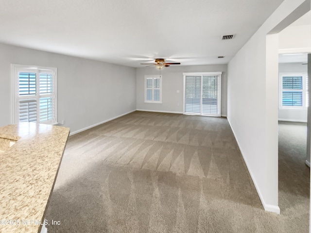 287 Buck Run Way, Saint Augustine, FL 32092 - unfurnished living room with a ceiling fan and carpet