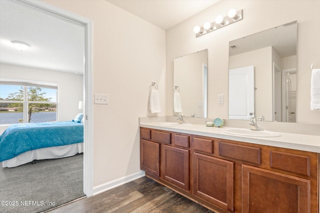 189 Blue Creek Way, Saint Augustine, FL 32086 - full bathroom featuring ensuite bathroom, double vanity, and wood finished floors