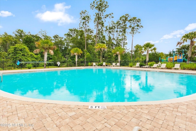 189 Blue Creek Way, Saint Augustine, FL 32086 - community pool with view of scattered trees and a patio