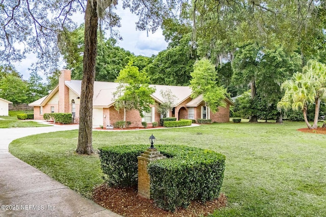 361 SE 34th St, Keystone Heights, FL 32656 - ranch-style house with a front yard and a chimney