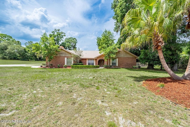 361 SE 34th St, Keystone Heights, FL 32656 - ranch-style house with a front lawn and brick siding