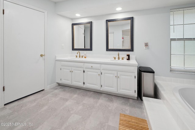 361 SE 34th St, Keystone Heights, FL 32656 - full bath featuring double vanity, a relaxing tiled tub, and recessed lighting