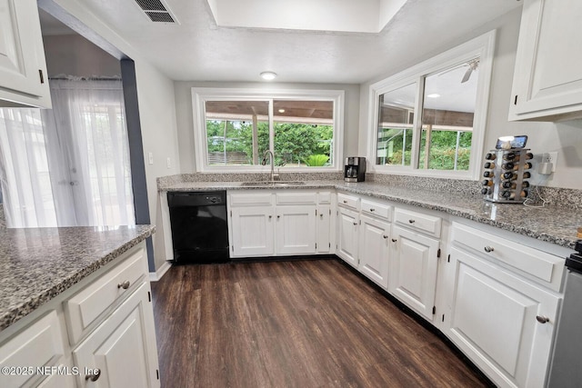 361 SE 34th St, Keystone Heights, FL 32656 - kitchen featuring black dishwasher, dark wood-type flooring, white cabinets, and plenty of natural light