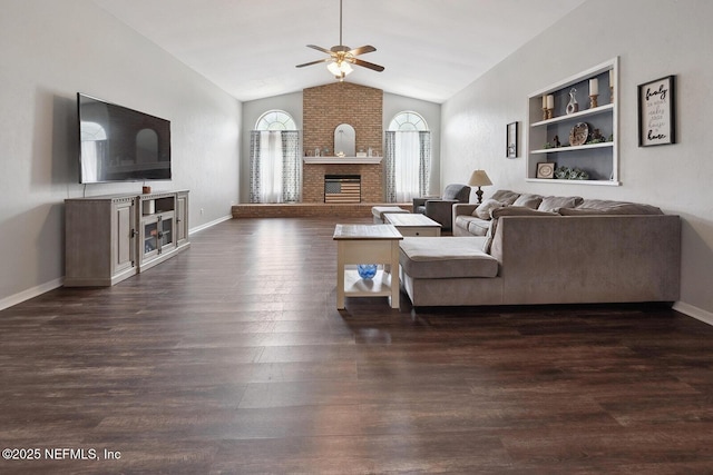 361 SE 34th St, Keystone Heights, FL 32656 - living room with a fireplace, lofted ceiling, a ceiling fan, and dark wood-style flooring