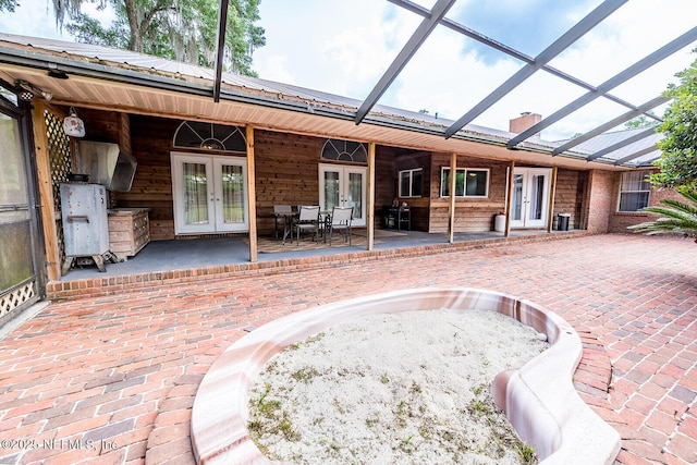 361 SE 34th St, Keystone Heights, FL 32656 - unfurnished sunroom featuring french doors