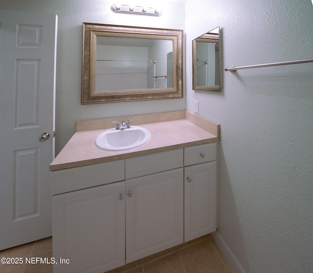 100 Fairway Park Blvd Unit 1004, Ponte Vedra Beach, FL 32082 - full bathroom with vanity, tile patterned flooring, and a textured wall