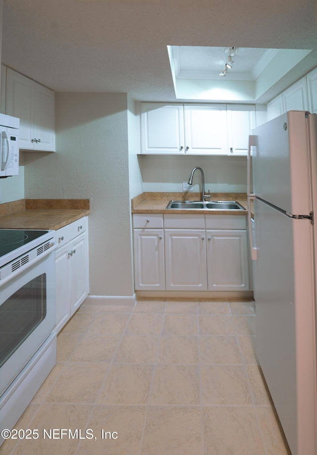100 Fairway Park Blvd Unit 1004, Ponte Vedra Beach, FL 32082 - kitchen featuring white appliances, track lighting, white cabinets, and light tile patterned floors