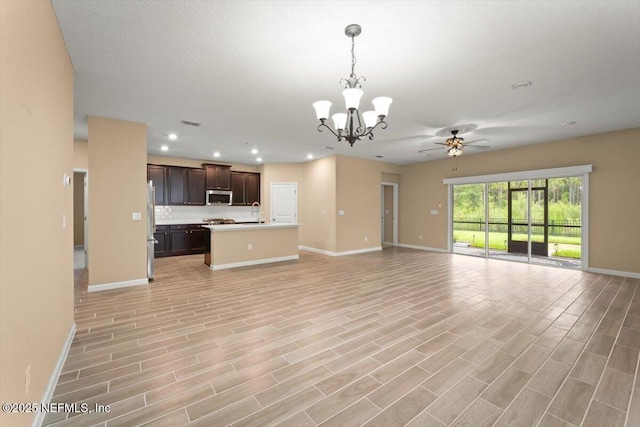 75570 Pondside Ln, Yulee, FL 32097 - unfurnished living room featuring a chandelier, ceiling fan, recessed lighting, and light wood finished floors