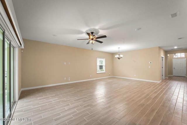 75570 Pondside Ln, Yulee, FL 32097 - unfurnished room with a chandelier, ceiling fan, and light wood finished floors