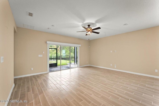 75570 Pondside Ln, Yulee, FL 32097 - empty room with ceiling fan and light wood finished floors