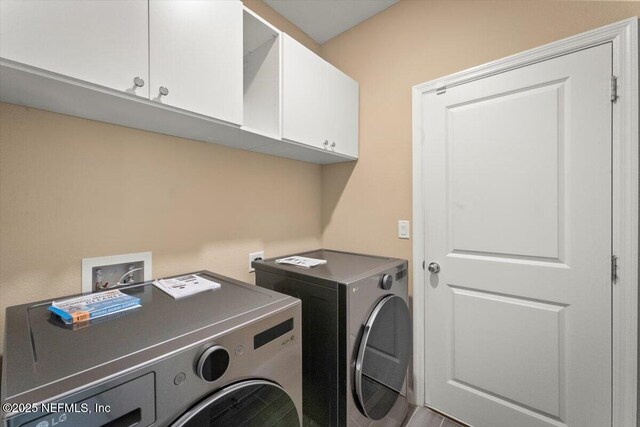 75570 Pondside Ln, Yulee, FL 32097 - laundry room with cabinet space and washing machine and clothes dryer