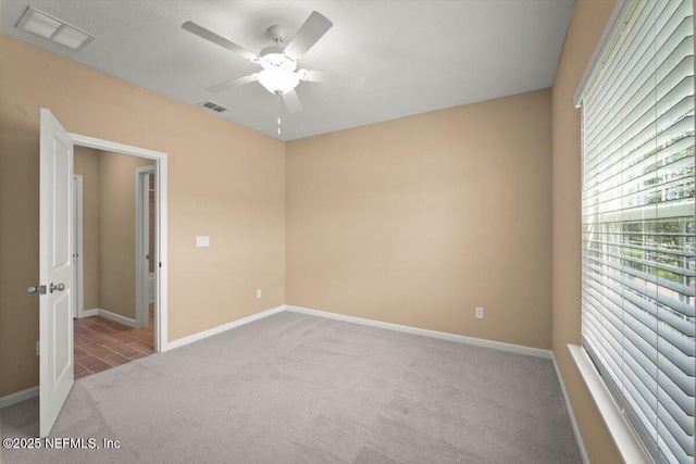 75570 Pondside Ln, Yulee, FL 32097 - spare room with carpet flooring and ceiling fan