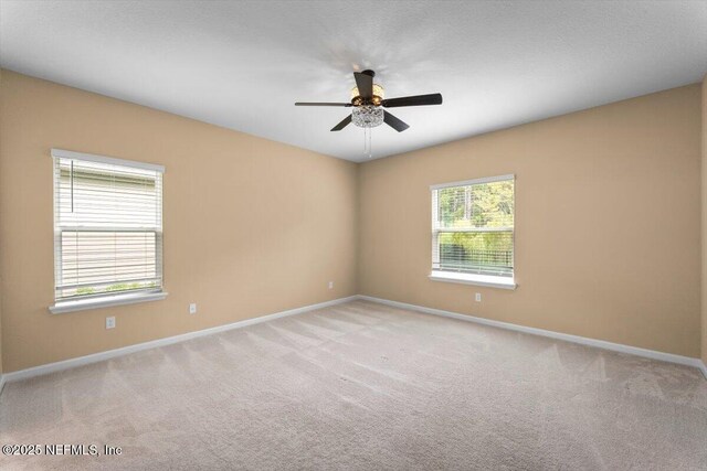 75570 Pondside Ln, Yulee, FL 32097 - spare room featuring a ceiling fan and light carpet
