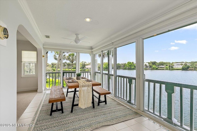 91 San Juan Dr Unit E3, Ponte Vedra Beach, FL 32082 - sunroom / solarium featuring ornamental molding, a water view, tile patterned floors, carpet floors, and arched walkways