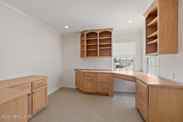 91 San Juan Dr Unit E3, Ponte Vedra Beach, FL 32082 - kitchen featuring open shelves, built in study area, crown molding, light colored carpet, and light countertops