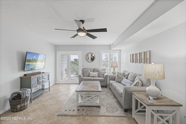 110 Ocean Hollow Ln Unit 114, Saint Augustine, FL 32084 - living room with ceiling fan, tile patterned flooring, and a textured ceiling
