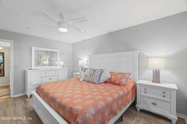 110 Ocean Hollow Ln Unit 114, Saint Augustine, FL 32084 - bedroom featuring wood finished floors, a ceiling fan, and a textured ceiling
