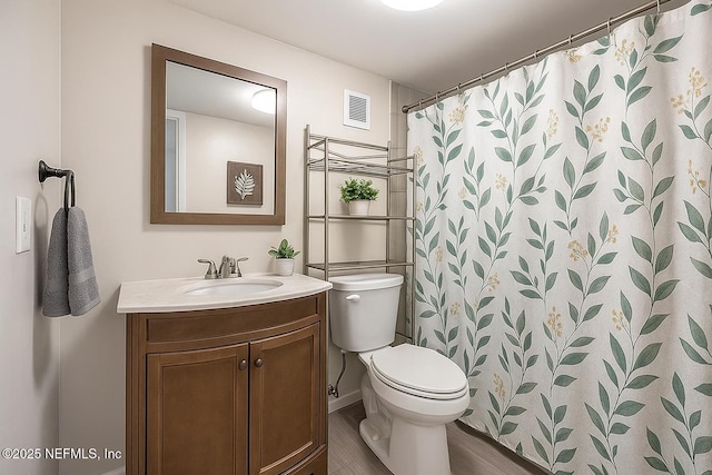 279 Selden Ave, Ormond Beach, FL 32174 - full bathroom featuring vanity, wood finished floors, and curtained shower