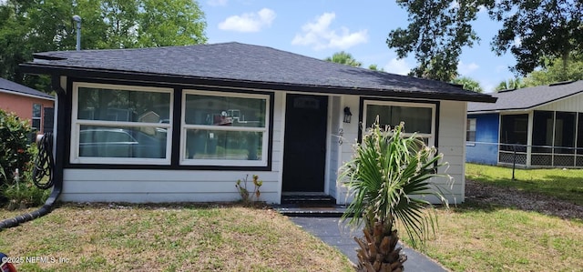 279 Selden Ave, Ormond Beach, FL 32174 - view of front facade with a front lawn and roof with shingles