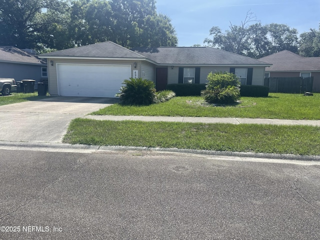 6993 Huntington Woods Cir W, Jacksonville, FL 32244 - ranch-style home with a front yard, driveway, and an attached garage