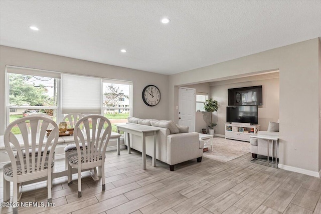 325 Sargo Rd, Atlantic Beach, FL 32233 - living room featuring wood finish floors, a textured ceiling, plenty of natural light, and recessed lighting