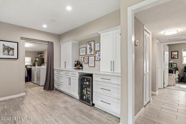 325 Sargo Rd, Atlantic Beach, FL 32233 - indoor dry bar with wine cooler, independent washer and dryer, light wood-style flooring, and recessed lighting