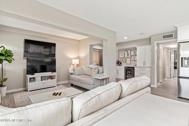 325 Sargo Rd, Atlantic Beach, FL 32233 - living room with a dry bar, wine cooler, and recessed lighting