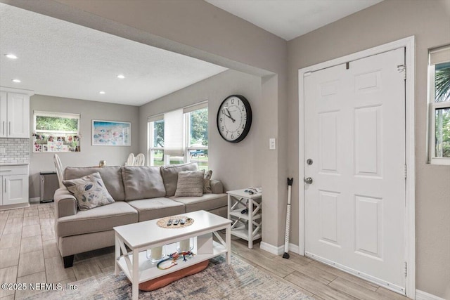 325 Sargo Rd, Atlantic Beach, FL 32233 - living room with light wood-type flooring, recessed lighting, and a textured ceiling